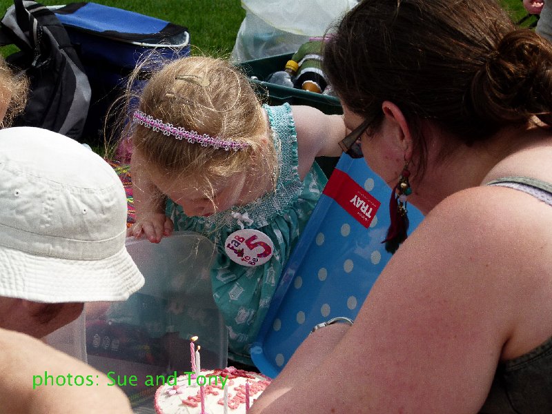 untitled_shoot-1050776.jpg - blowing out the birthday candles (after many attempts to light them in the breeze)